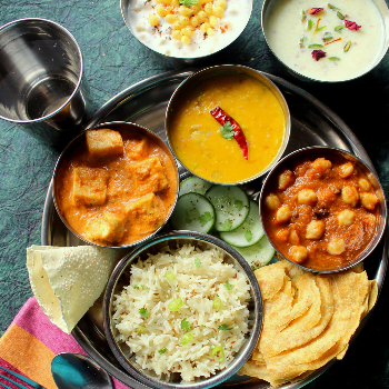 RADHIKA CAFE - Savoring Tradition: How Radhika Special Thali Elevates the Indian Dining Experience in Faridabad