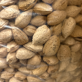 Premium Kashmir Badam Almonds from FEROZ AHMAD NAIK in Srinagar, showcasing their rich texture and quality. - Image 1