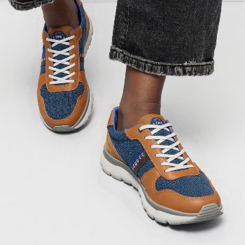Casual Leather Sinker Sports Shoes displayed in Nagpur store