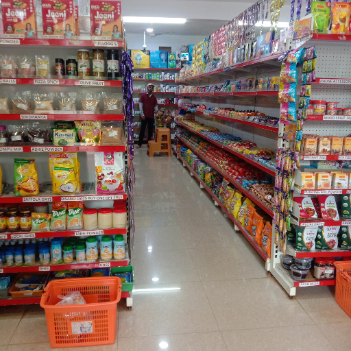 A vibrant display of assorted groceries available at NATIONAL HYPER MART in Tirthahalli including fresh vegetables, fruits, a