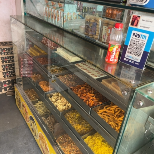 Assorted traditional sweets from KAILASH TAK in RANGA REDDY displayed on a plate, showcasing vibrant colors and textures. - Image 2