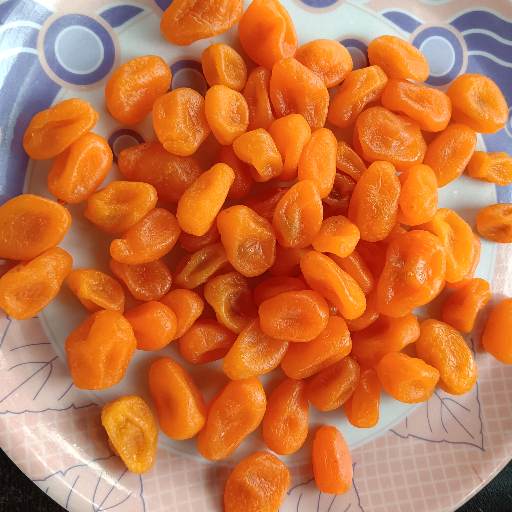 Fresh Beby orange 🍊 displayed on a wooden table with vibrant color, sourced from Ok dryfruits in URALIKANCHAN - Image 1