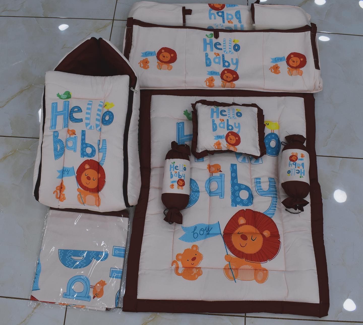 Hello Baby Lion 4-Piece Newborn Bedding Set in GJ featuring a colorful lion print, soft mattress, pillow, bolsters, and blank