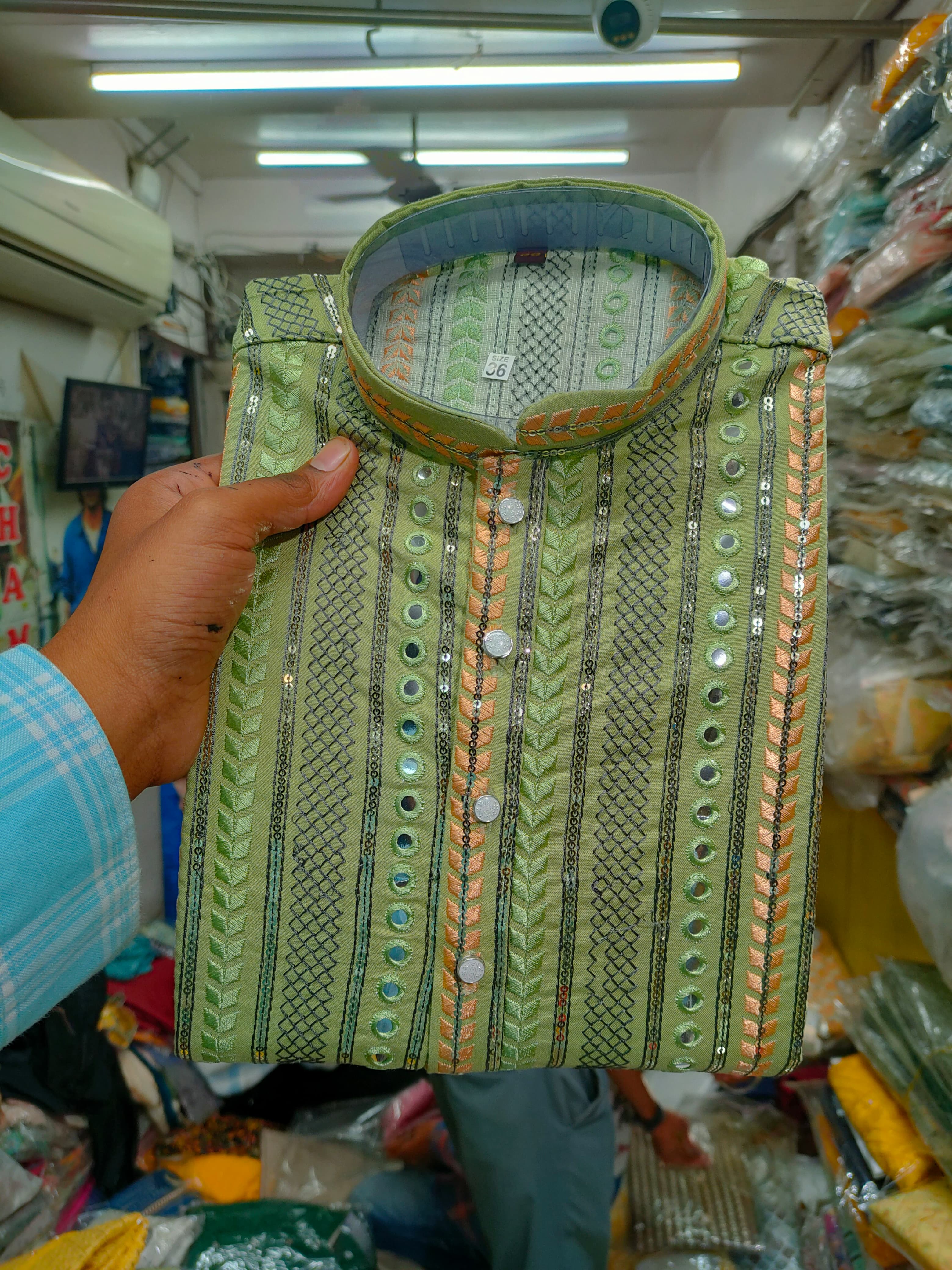 AADI STORES designer men's kurtas displayed at Jigar Adani in GJ, showcasing traditional and modern styles.