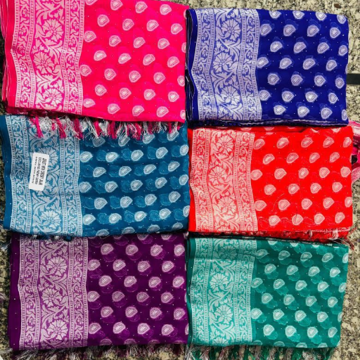 Elegant saree with intricate designs displayed at TIRUMALA KAPAD DUKAN in Pusad, showcasing vibrant colors and rich fabric.