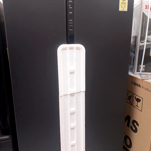 Haier refrigerator in black color with 596 litres capacity displayed in Sampla, showcasing advanced cooling features.