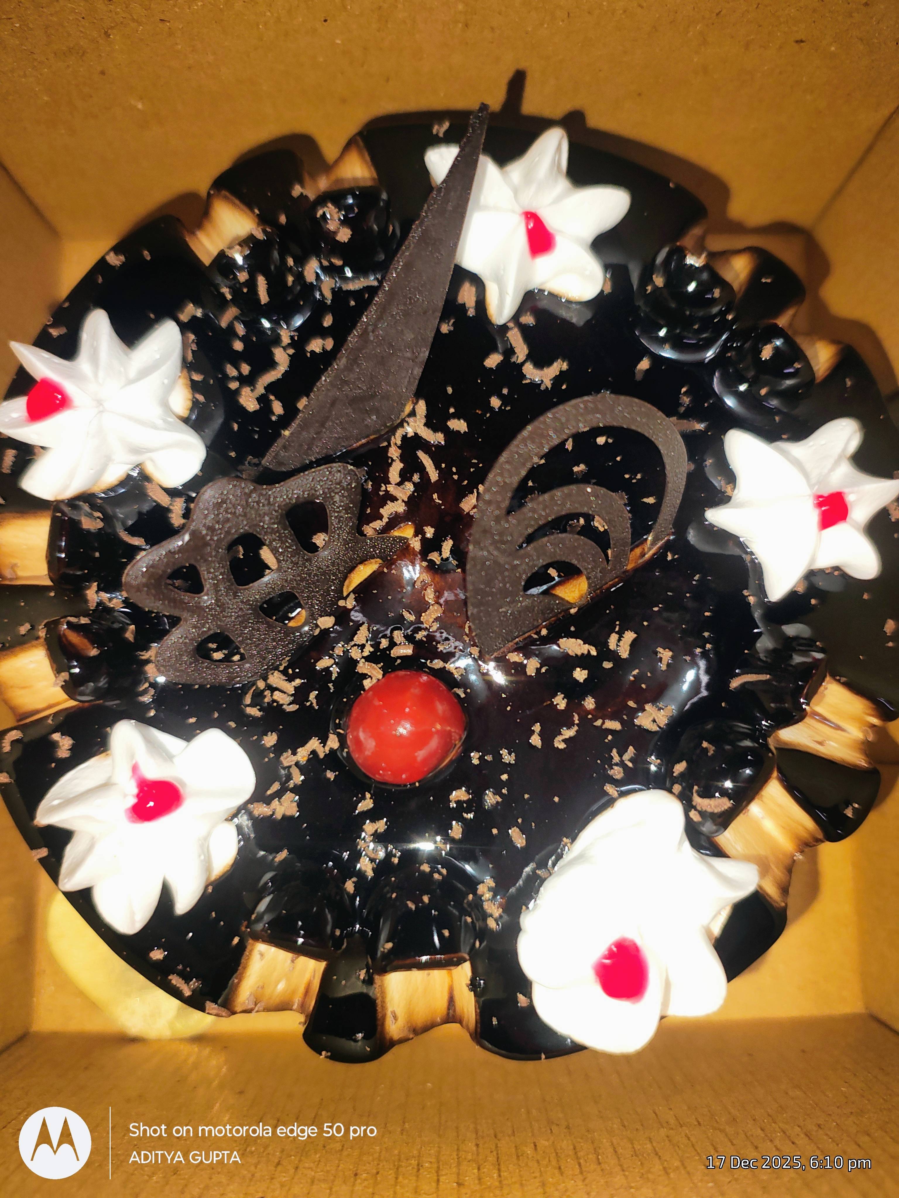 Delicious birthday cake from ADITYA KIRANA STORE in RAEBARELI, decorated with vibrant icing and ready for celebrations.
