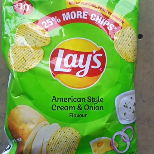 Crispy Lays Potato Chips in TAPUKRA, showcasing golden, crunchy texture and vibrant packaging highlighting the product name.