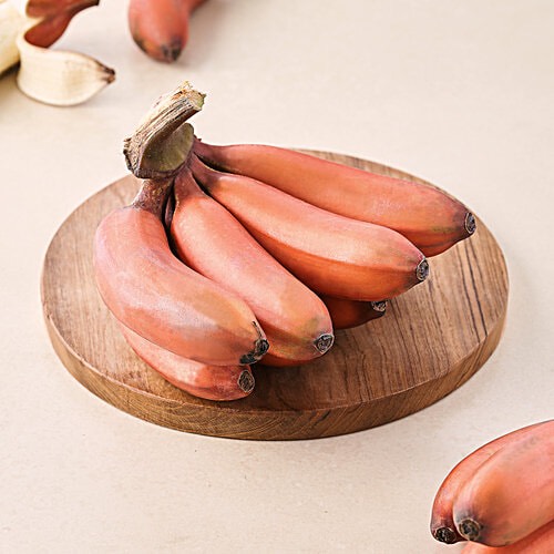 Sweet and nutrient-rich fresh red bananas stacked together, showcasing their vibrant color and healthy appeal in Ahmedabad.