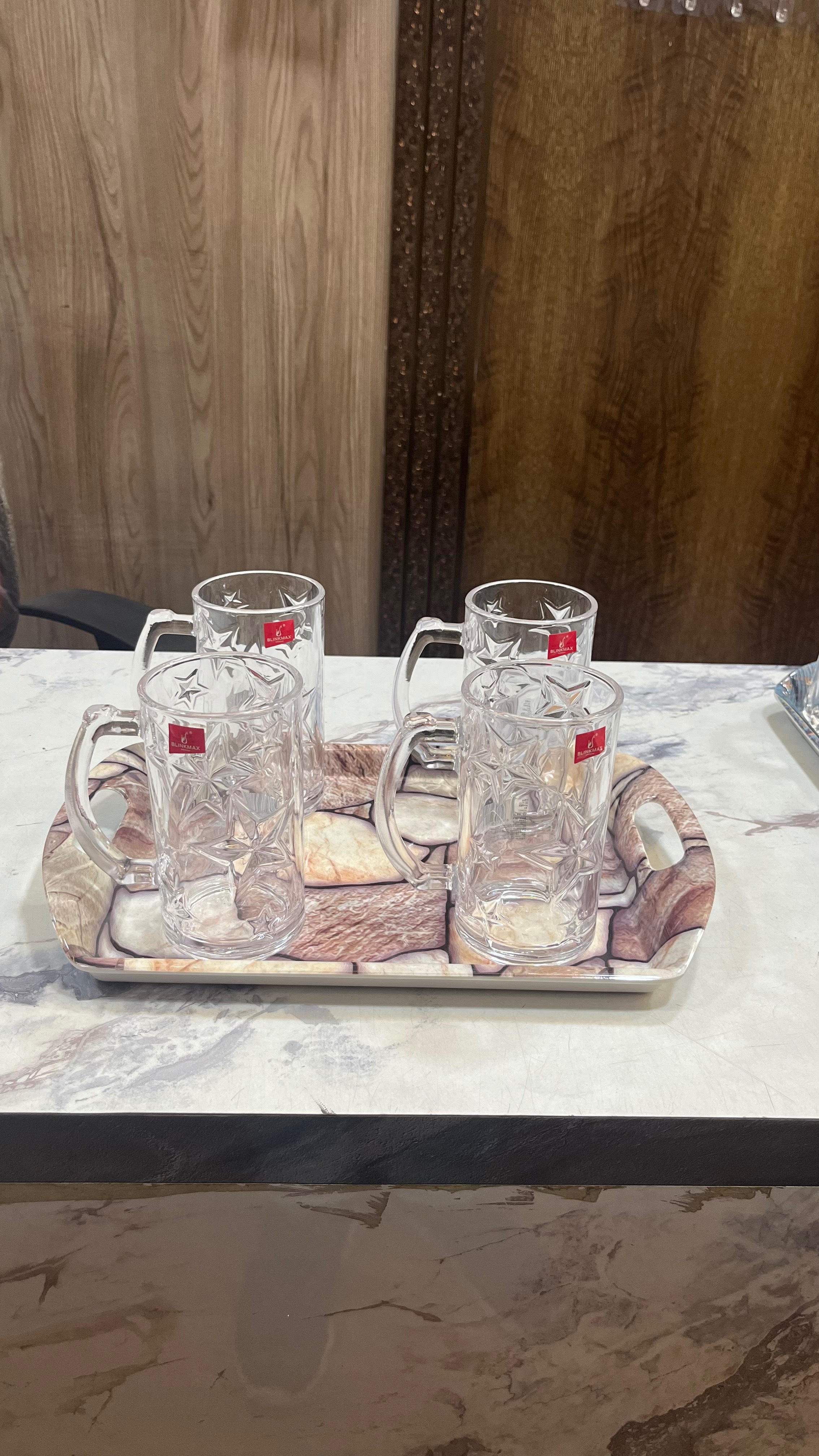 A set of stylish beer mugs displayed at MS KHANNA COOKWARE in Ghaziabad, showcasing their elegant design.