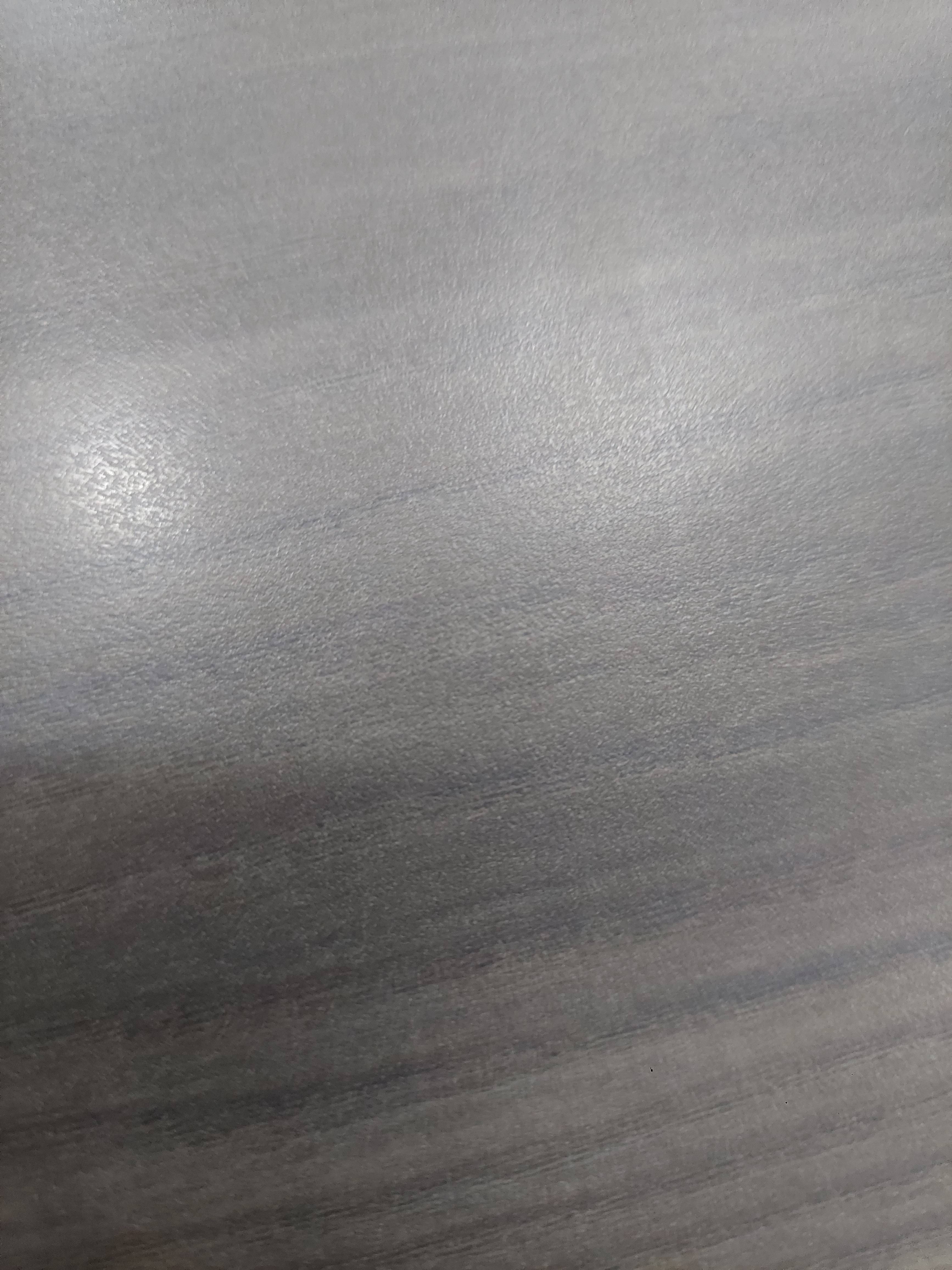 Premium grey wood laminate sheet designed for furniture enhancements available at PUSHPAM STEEL CENTRE in Mumbai, showcasing 