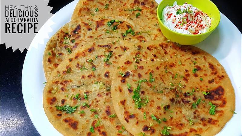 Delicious SWAD AE SHAKAHARI Aloo Prantha served with creamy curd in Patiala — a perfect Punjabi delight.