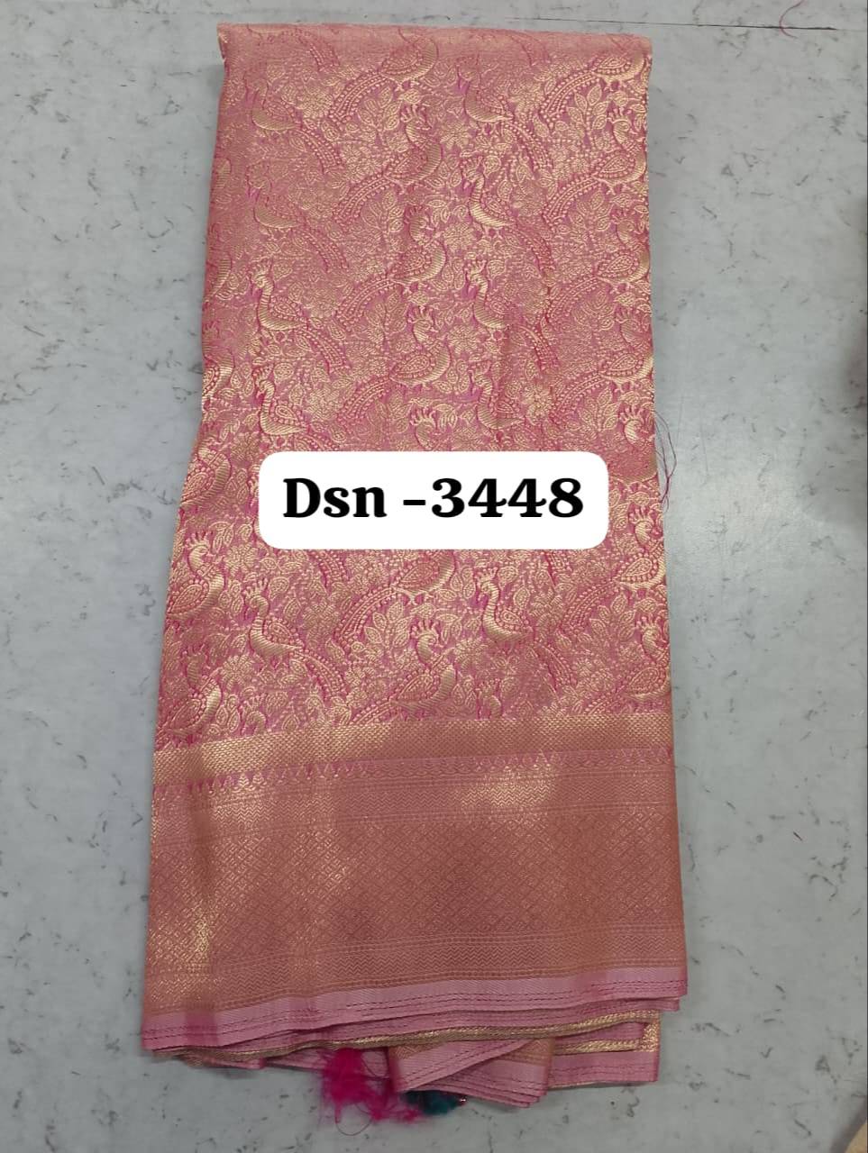 Elegant Banarasi Silk Saree in Surat showcasing intricate zari patterns, perfect for festive occasions and traditional wear.