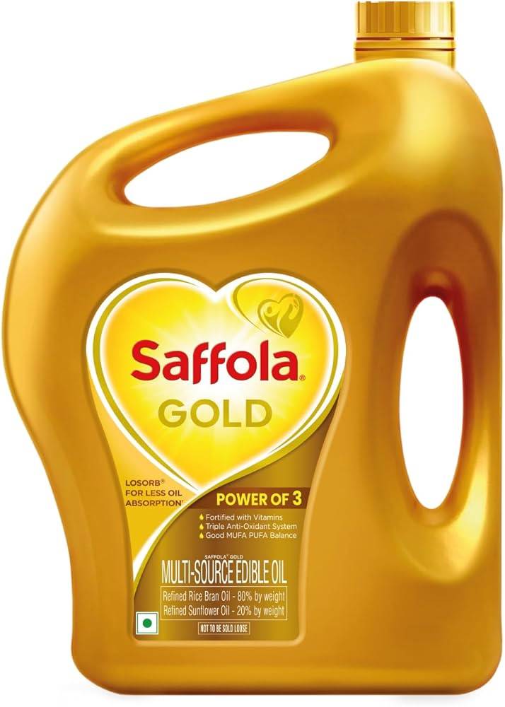 Saffola Gold Refined Oil bottle, showcasing its golden liquid, labeled heart-healthy cooking oil, available in Devigarh.