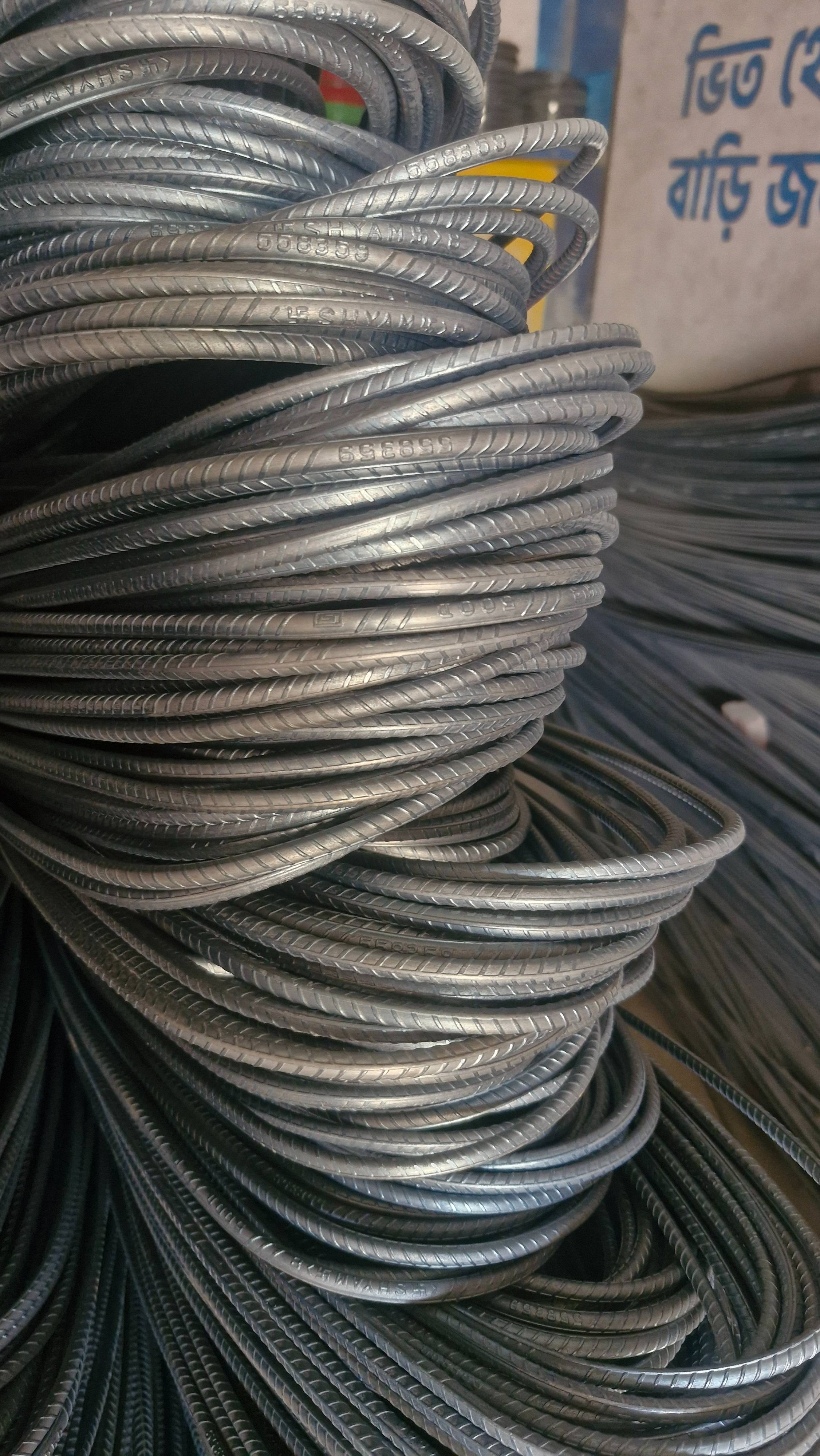 Steel Rebar Coil, a premium reinforcing material, coiled tightly, showcasing its durability and strength in Plassey, West Ben