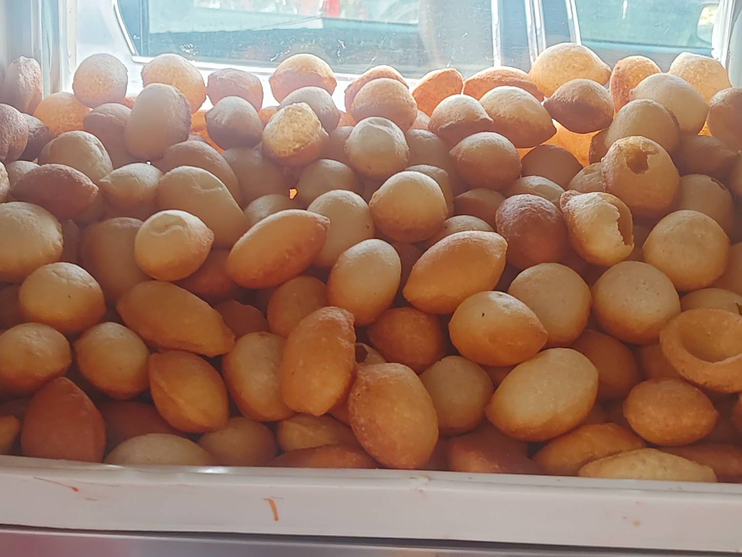 Crispy Pani Puri filled with spicy water and chutney from VASHDEV SON OF HUKUMASINGH in Gaggal, Himachal Pradesh.