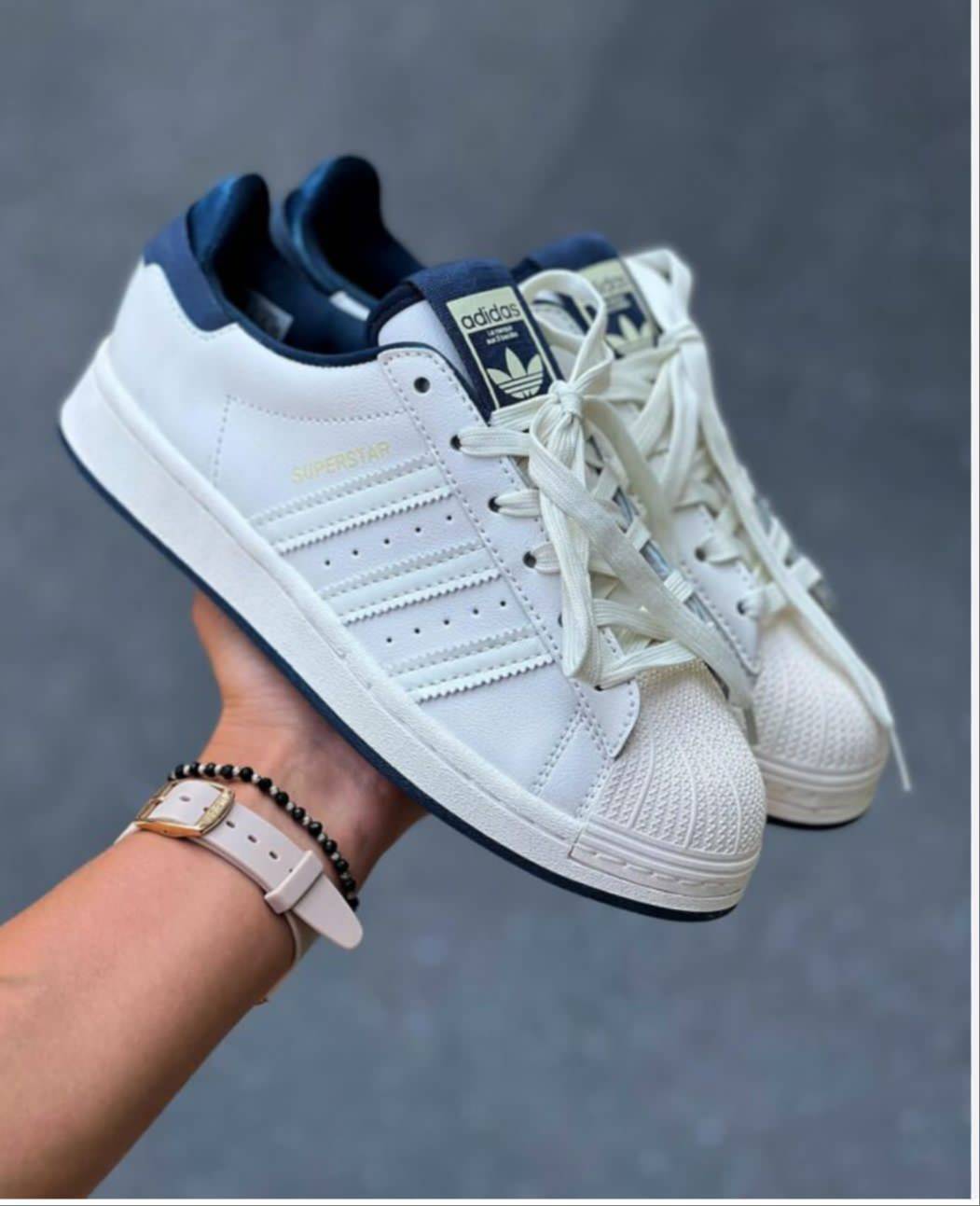 Stylish and comfortable Superstar Sneakers in RANGPO, classic white design suitable for casual wear, showcasing elegance and 