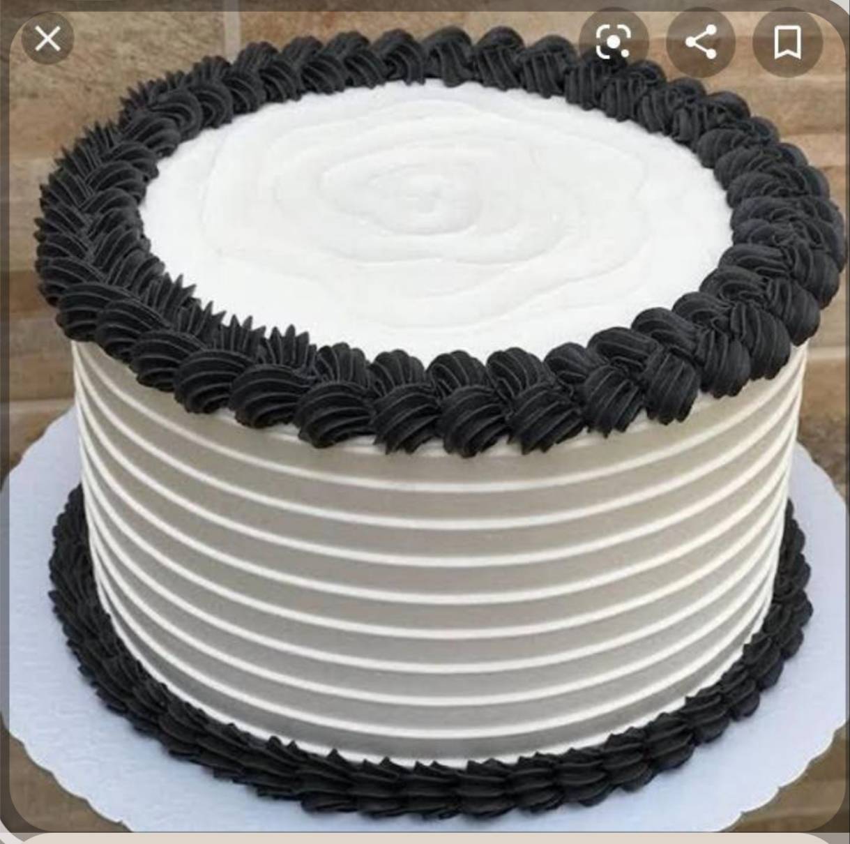 Elegant Black Forest Cake featuring rich chocolate layers and white cream decoration, available at THE SANDWICH COMPANY in Am