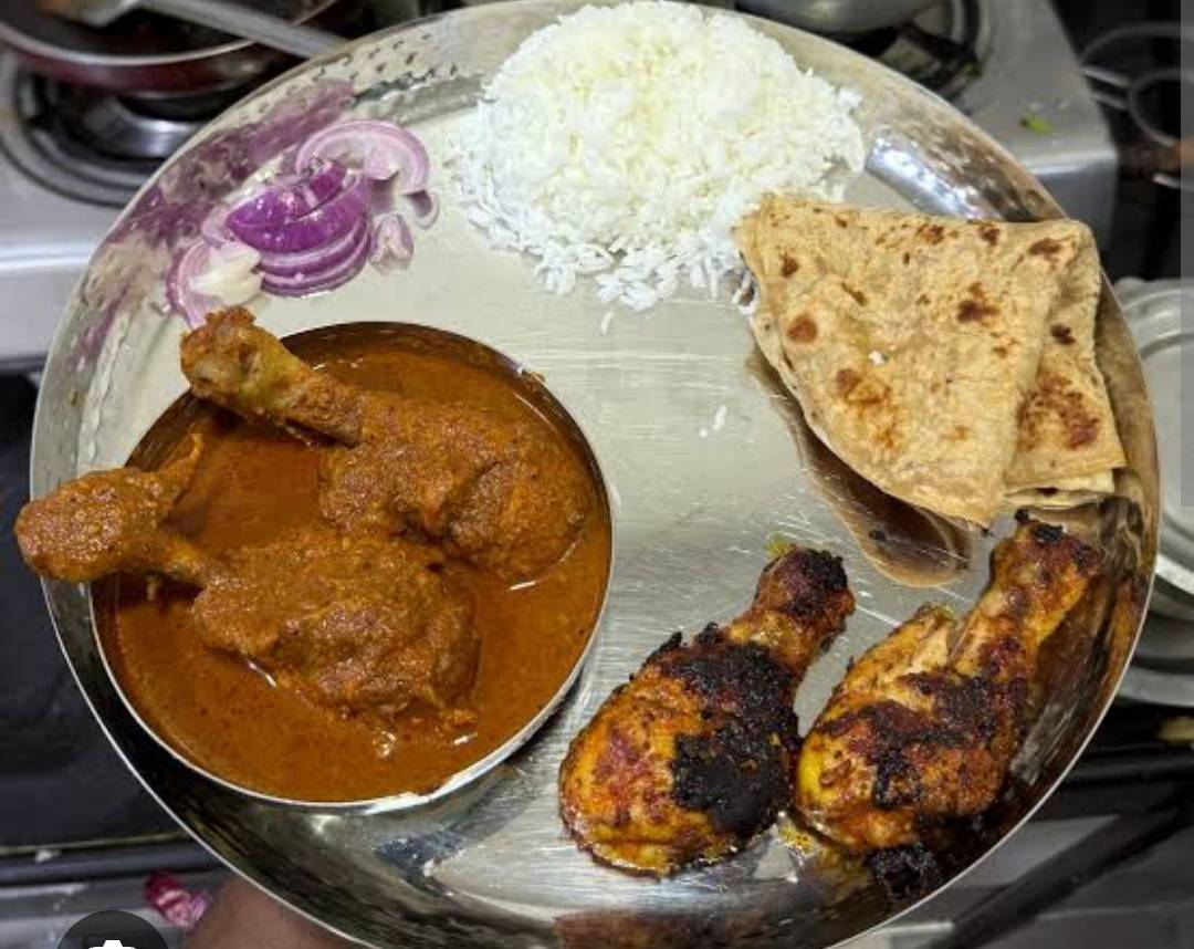 Delicious Chicken Thali from Hotel Krushna in Loni BK featuring tender chicken, rice, and flavorful sides