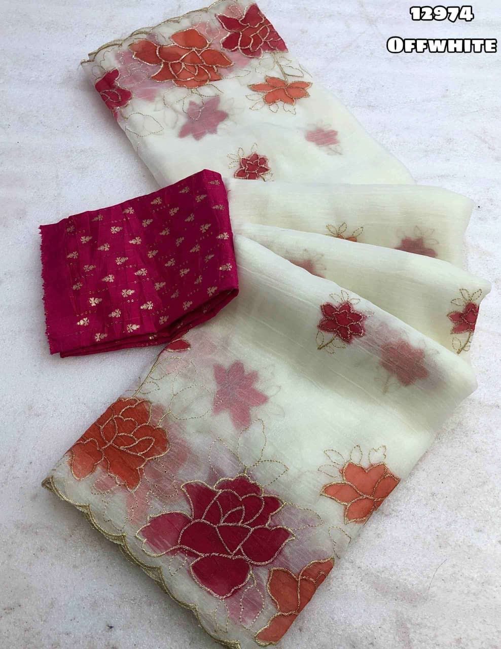 Elegant offwhite saree with colorful floral embroidery displayed in Gwalior, showcasing intricate design and craftsmanship.