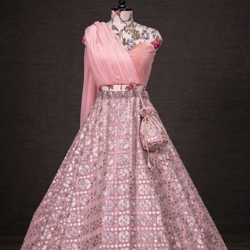 Elegant pink embroidered lehenga with intricate patterns, perfect for weddings, displayed at NAGPAL AGENCIES in Ambala City.