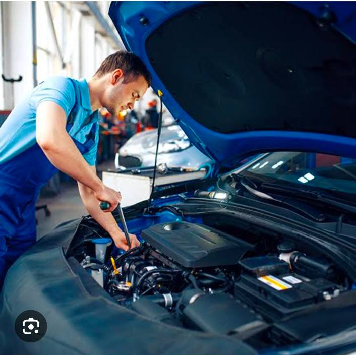 Professional automotive service at SACHIN VERMA in RADAUR, showcasing skilled technicians working on a vehicle.