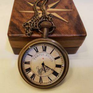 Vintage brass pocket watch with Roman numerals and wooden box, displayed elegantly, showcasing its antique charm in Bijnor.