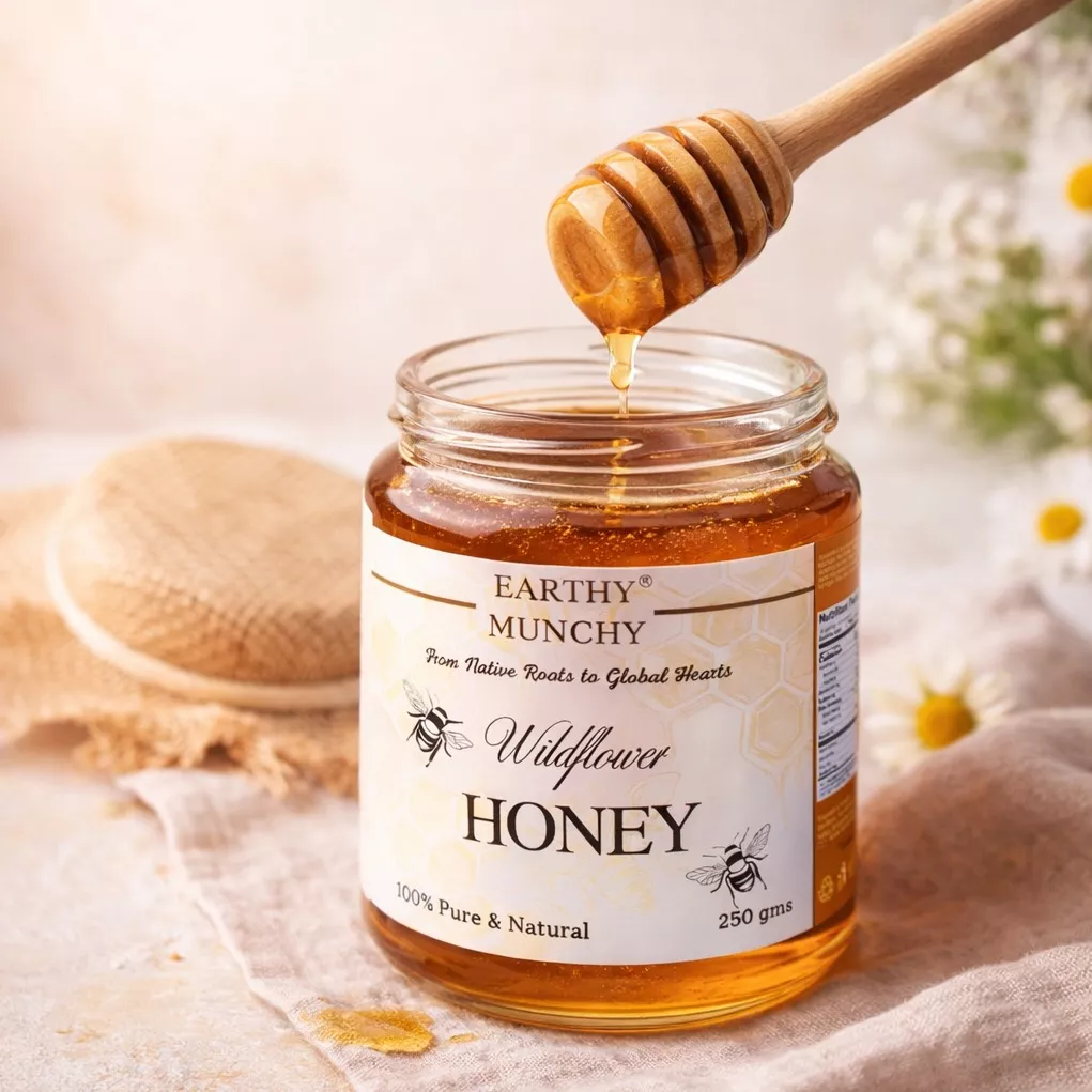 Earthy Munchy Wildflower Honey jar in Bangalore, showcasing a rich golden color and a label indicating it's ethically sourced