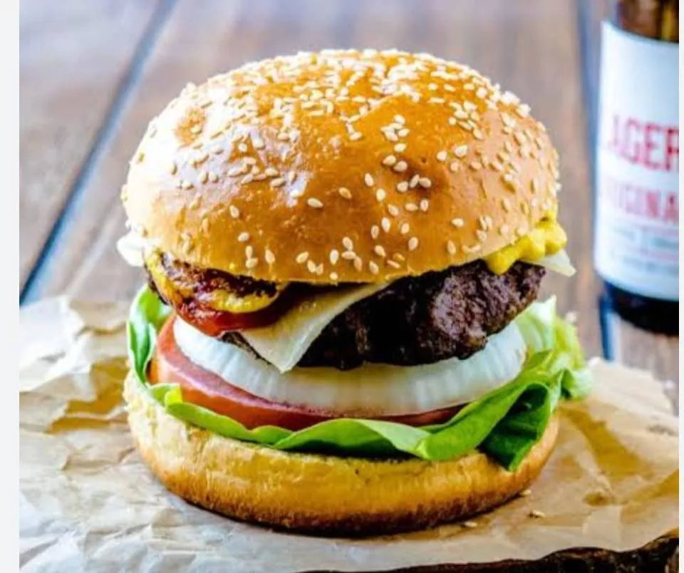 Classic Beef Burger with a juicy patty, fresh toppings, and sesame seed bun from GOURAV in Pathankot, ready to be enjoyed.