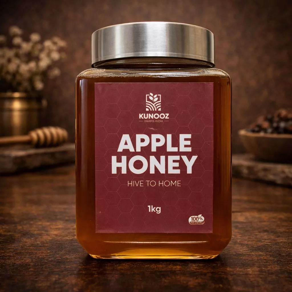 Pure Kunooz Apple Honey jar with a golden hue, sourced from Kashmiri apple gardens, showcasing its rich texture and color in 