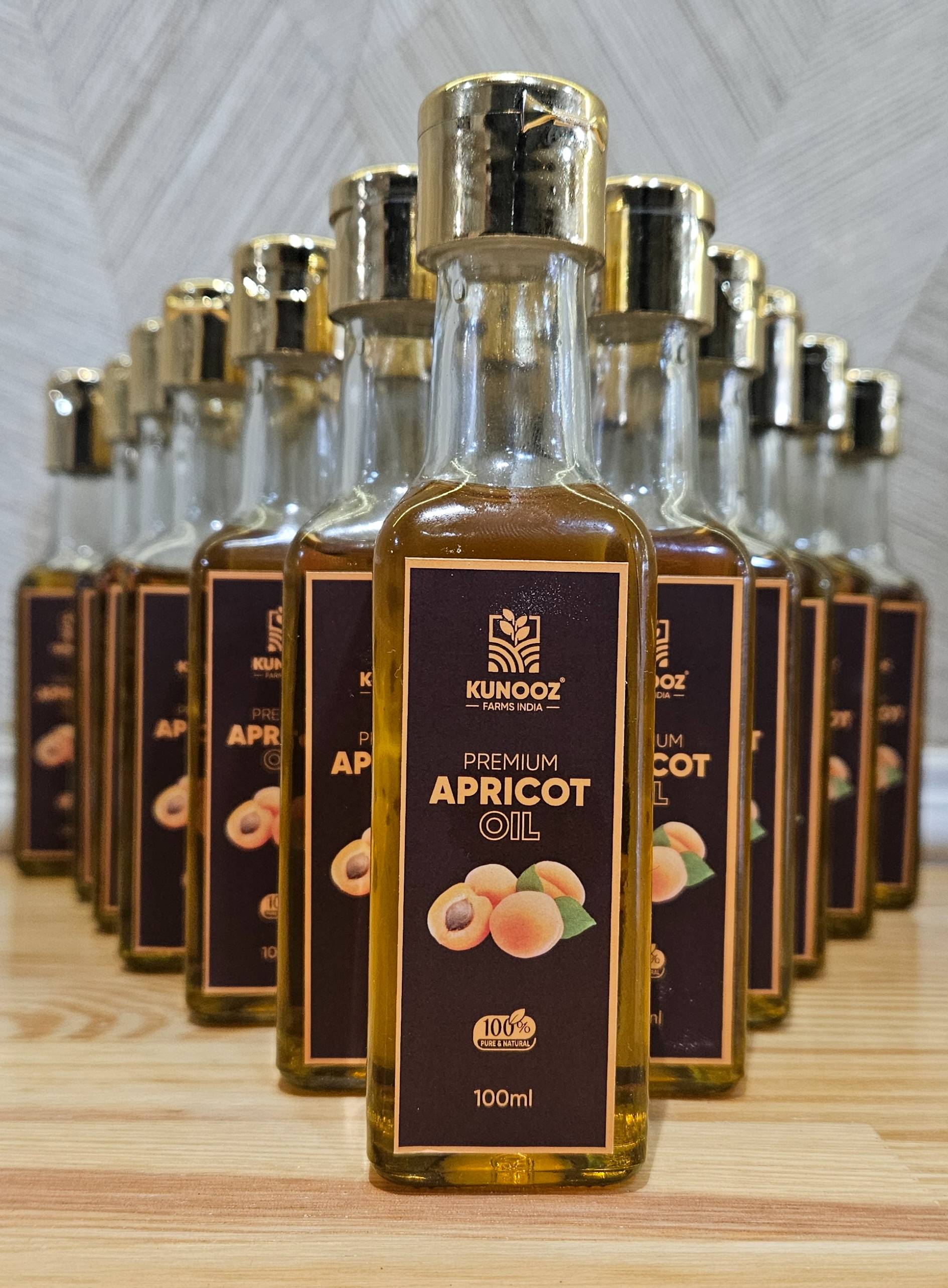 Kunooz Premium Apricot Oil bottle on a clean surface, showcasing its nourishing properties for skin and hair in Hyderabad.