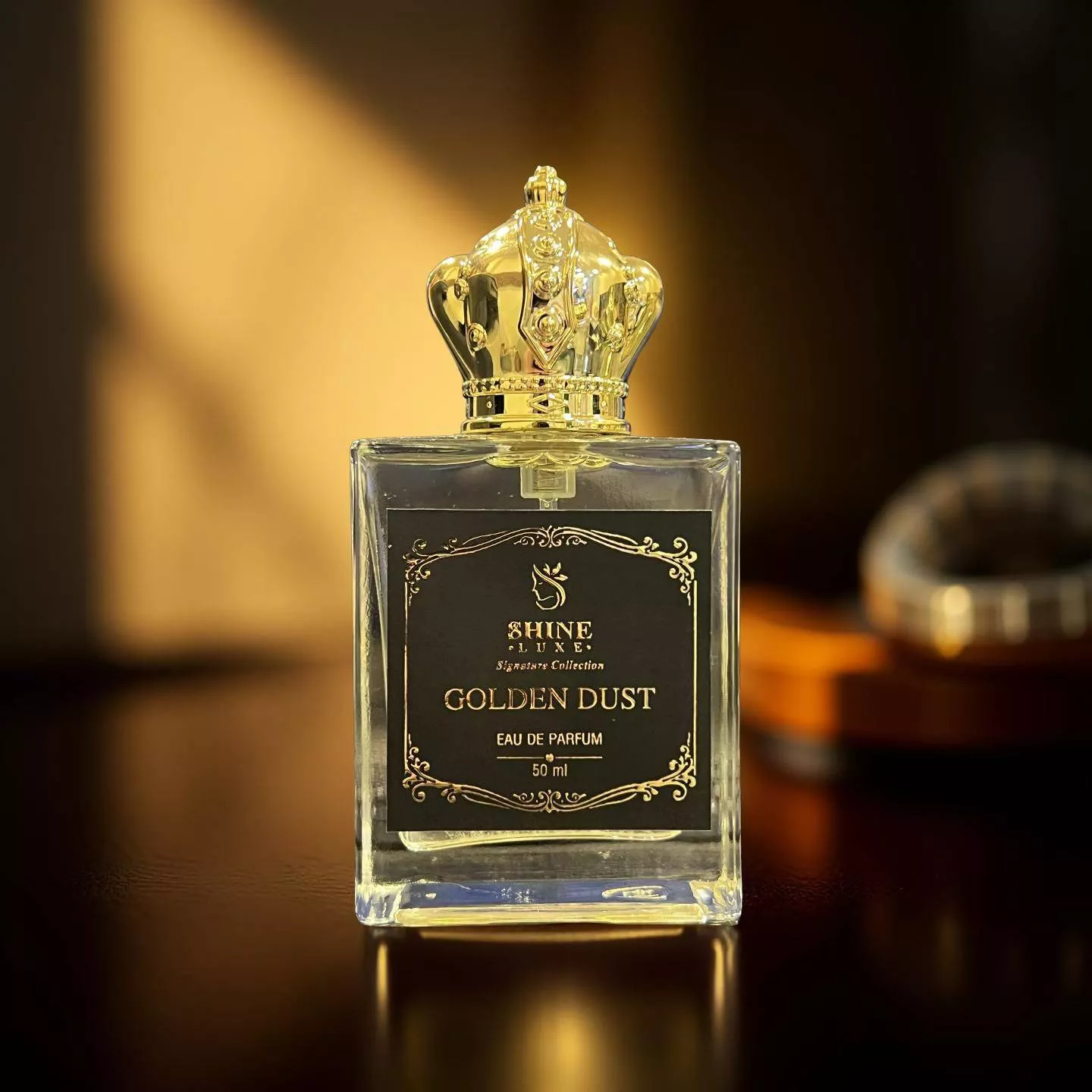 Golden Dust Eau de Parfum bottle on a sleek surface, showcasing its elegant design and sophistication in Kolkata