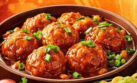 Delicious plate of Manchurian served at DBA HOTEL NARAYAN in Jhaknawada, garnished with spring onions and served with a tangy