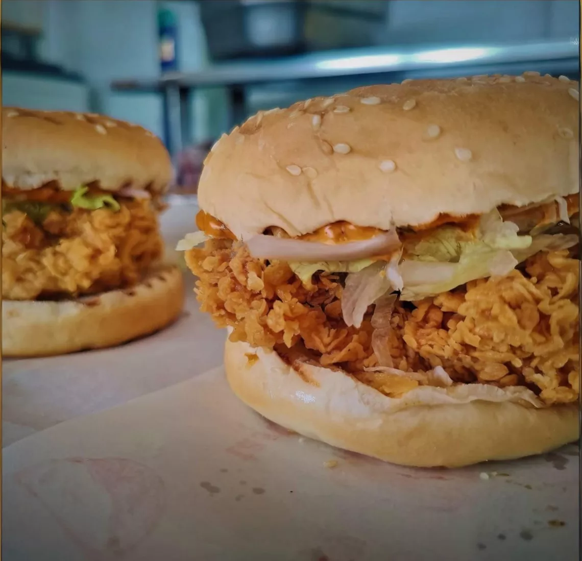 Delicious burger with fresh toppings served at THE FARMER BISTRO in Ludhiana, showcasing a juicy patty and vibrant vegetables