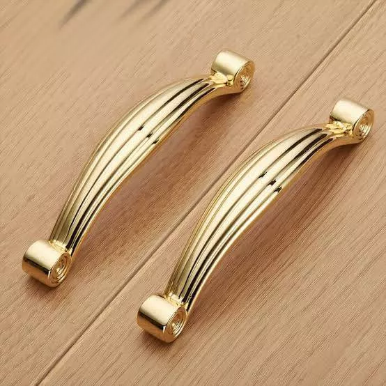 Elegant gold cabinet handles designed to add a sophisticated touch to cabinetry, featuring a sleek design perfect for modern 