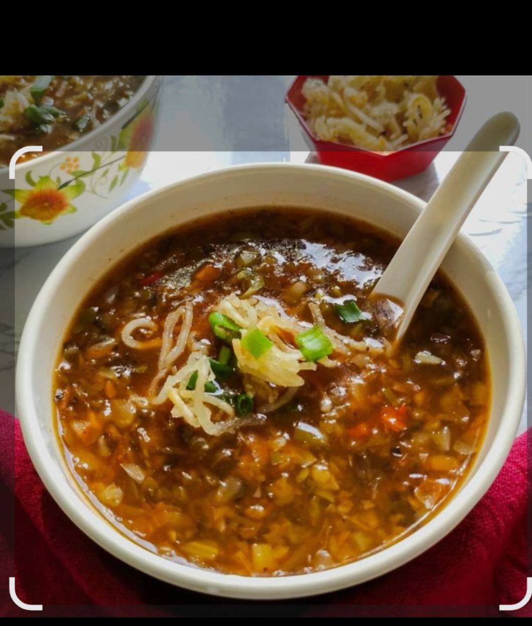 A bowl of rich Veg Manchow soup with fresh vegetables and aromatic spices, served hot at CHILLI POTATO FAST FOOD AND B B Q in