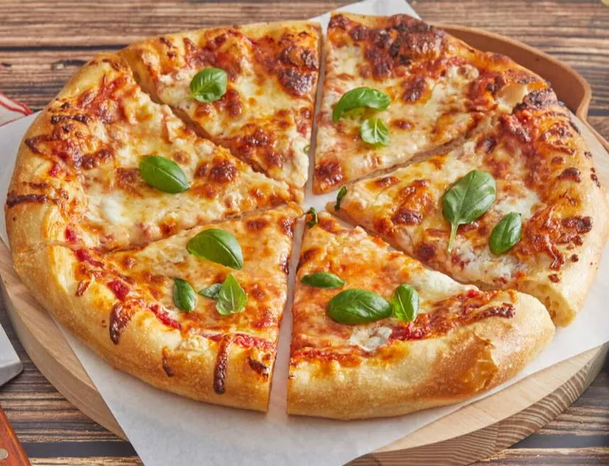 Delicious Classic Pizza topped with fresh ingredients, served at BROOKS CAFE AND DINER in Batala, showcasing its authentic It
