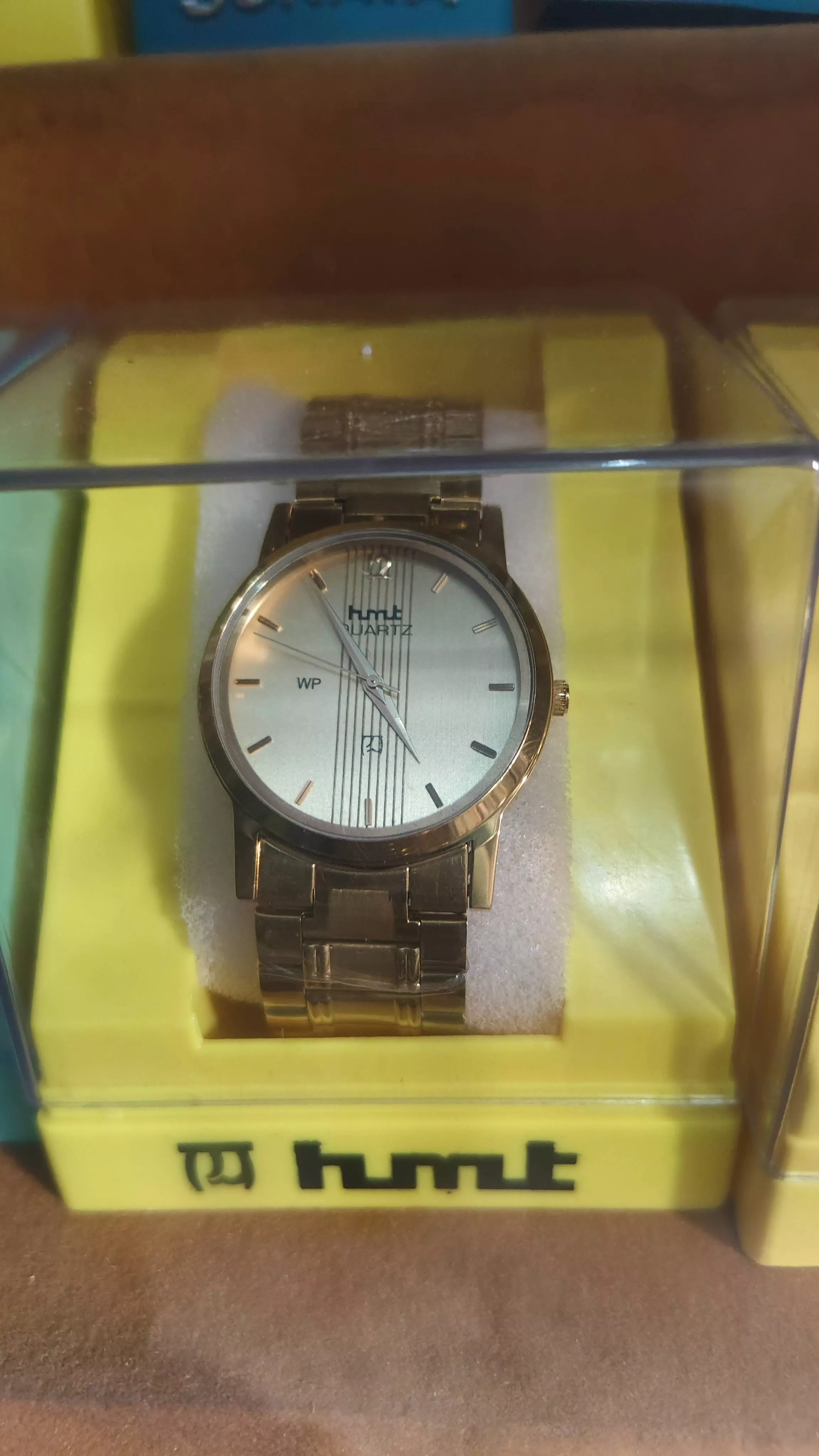 Elegant HMT Quartz Wrist Watch with gold finish and water resistance available in Sirathu, ideal for everyday wear.