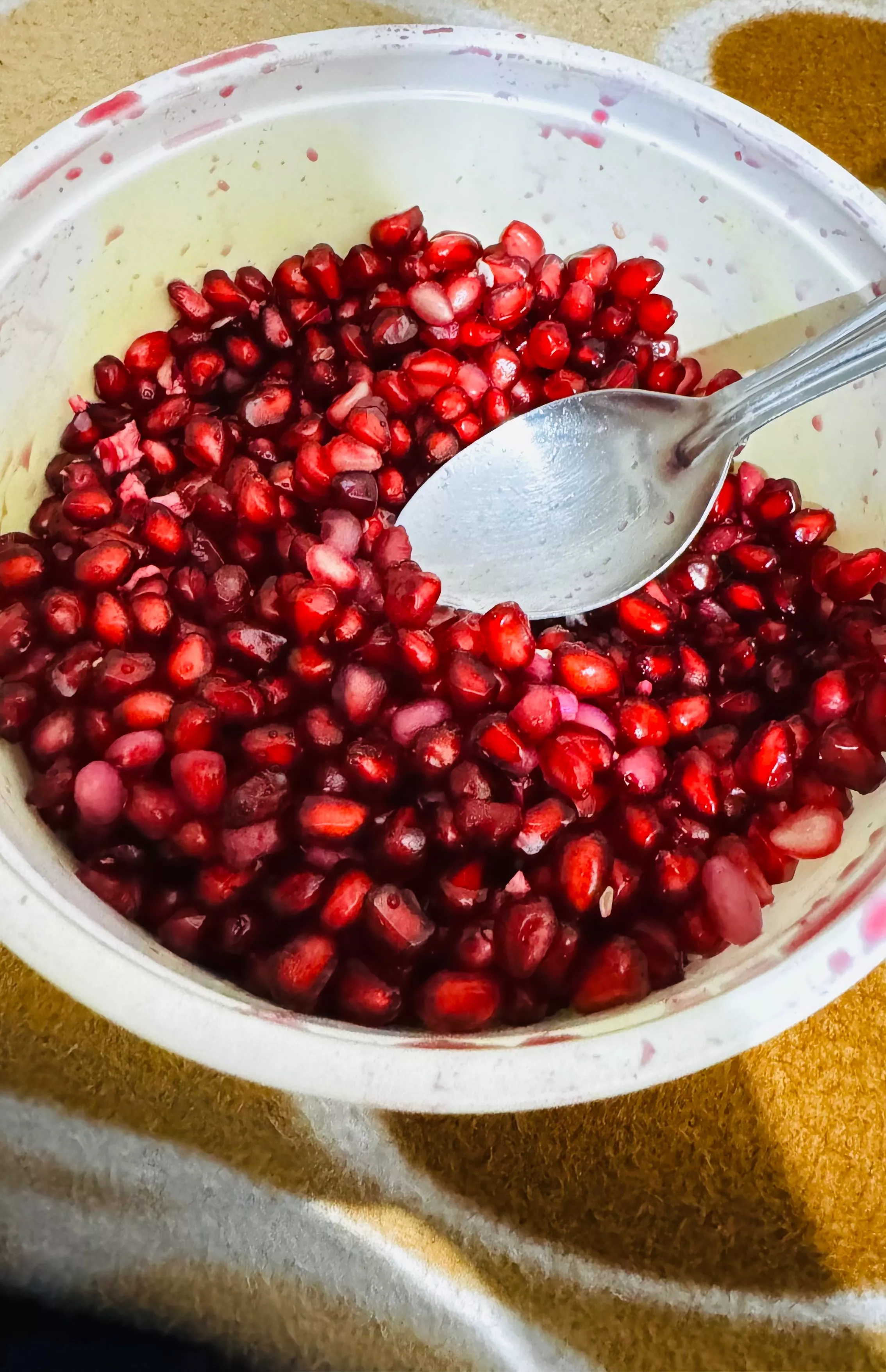 Fresh and juicy pomegranate arils in a clear package, showcasing vibrant red seeds, perfect for snacking, from JAPNEET SINGH 