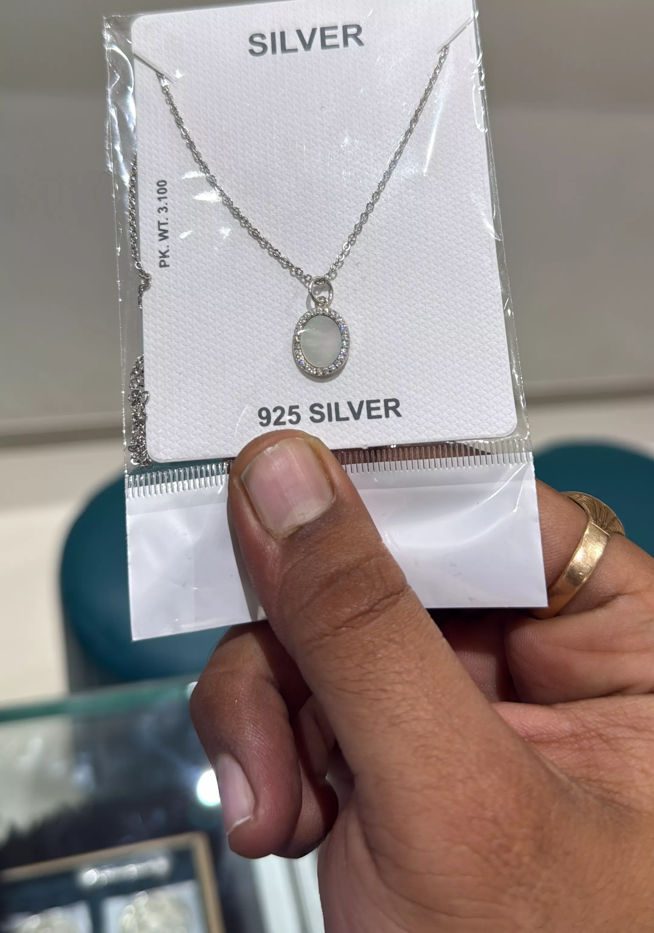 Elegant 925 silver pendant necklace displayed against a soft background, showcasing its radiant charm in Rajkot.