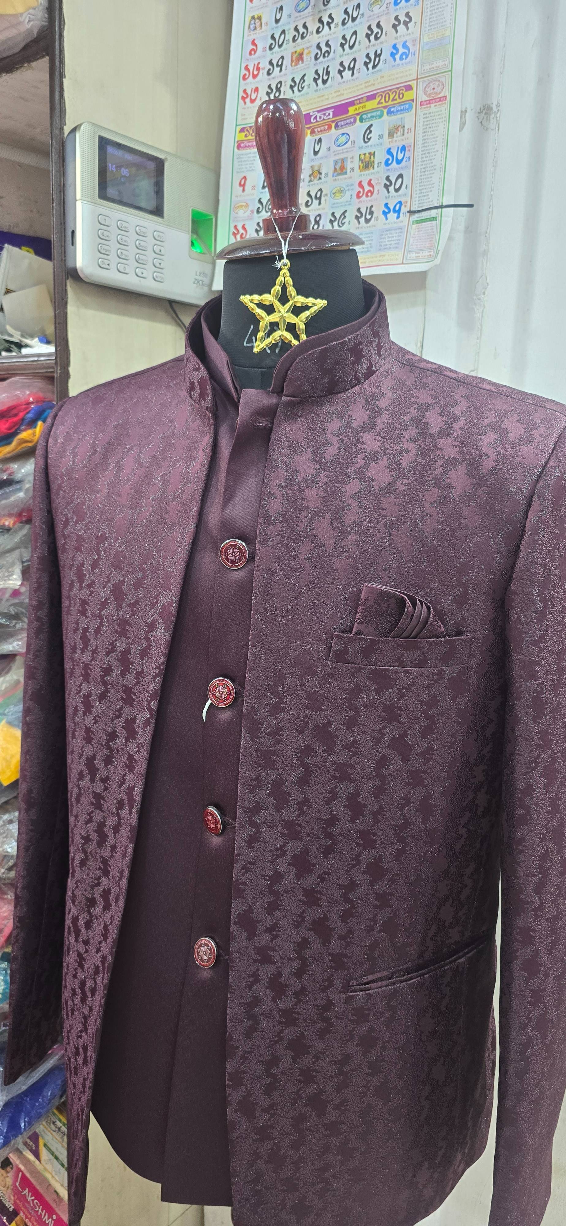 Stylish maroon Nehru jacket with elegant pattern and pocket square, available at NISHUS COLLECTION in Durgapur.