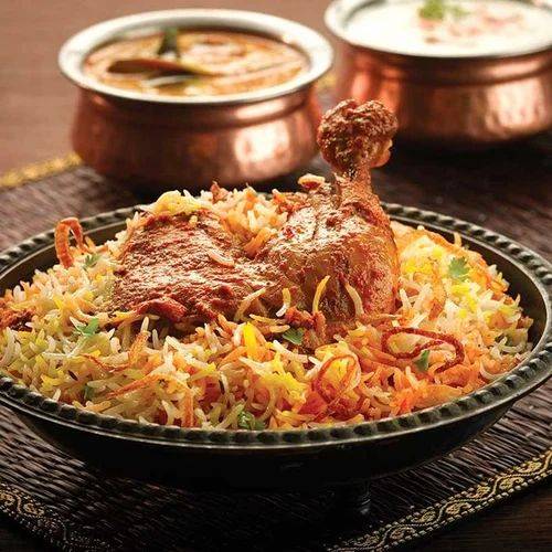 Delicious Spicy Kitchen Chicken Biryani with tender chicken and spices in ANGUL, served in a vibrant bowl.