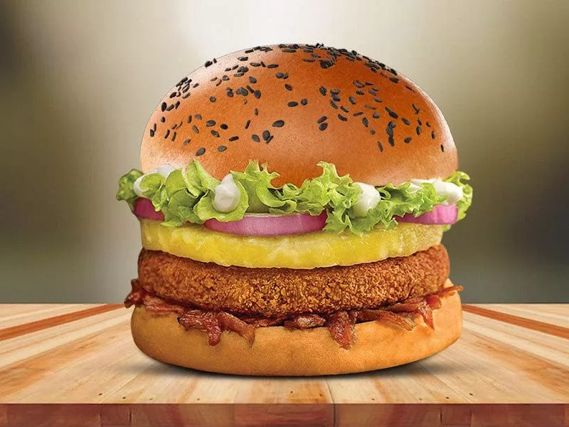 A delicious Plant-Based Veg Burger in PACHAAT, featuring a fresh bun, vibrant vegetables, and a hearty plant-based patty.