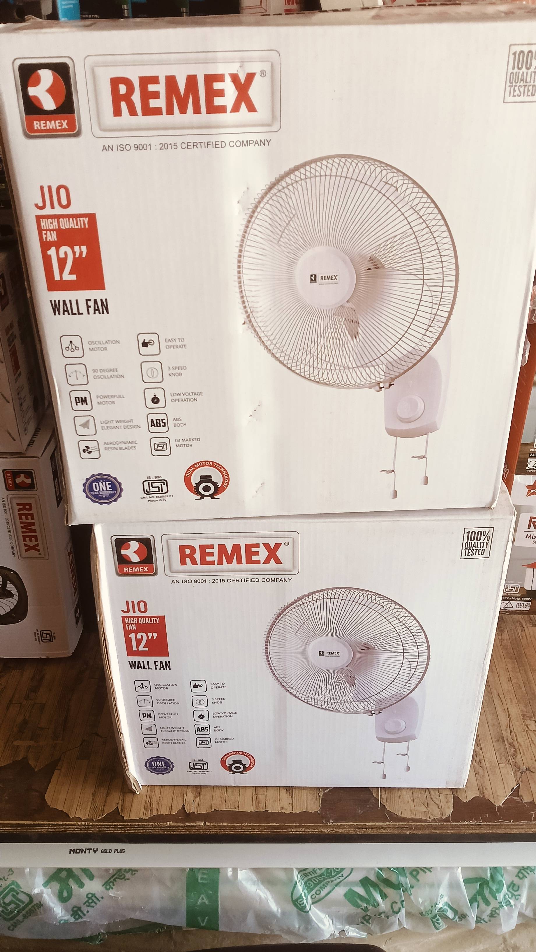 Remex wall fan with oscillation feature, 12-inch size, designed for wall mounting, featuring three-speed settings, displayed 