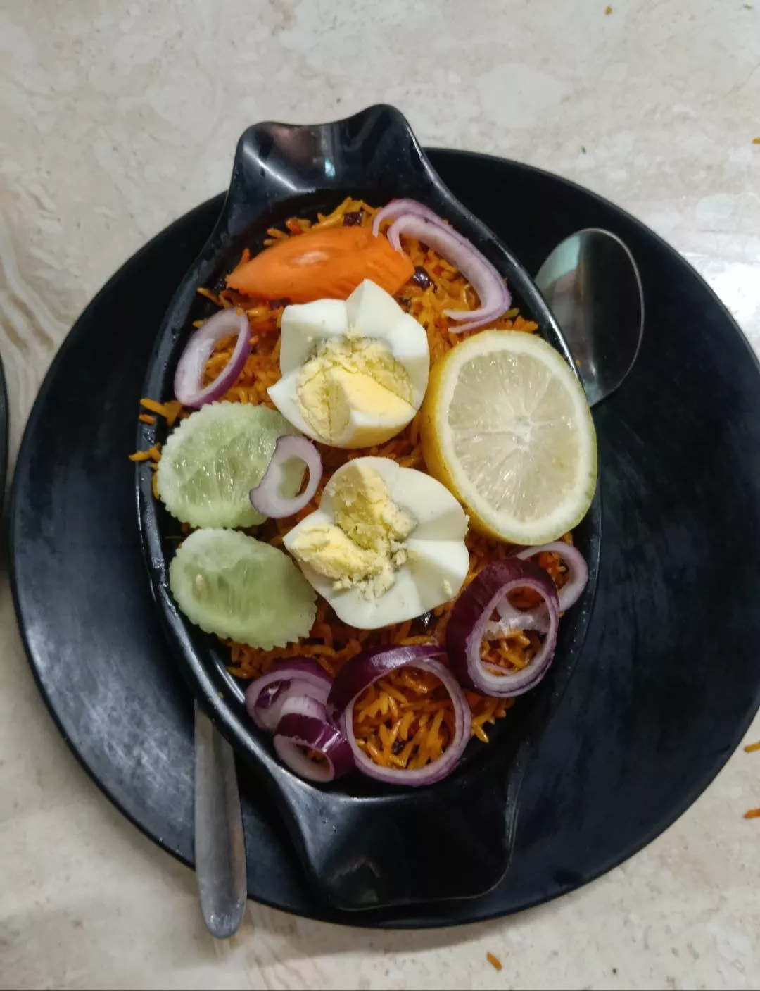 Delicious and hygienic Biriyani served in a bowl with aromatic spices and rice, presented at KI KHABO RESTAURANT in PATHSALA.