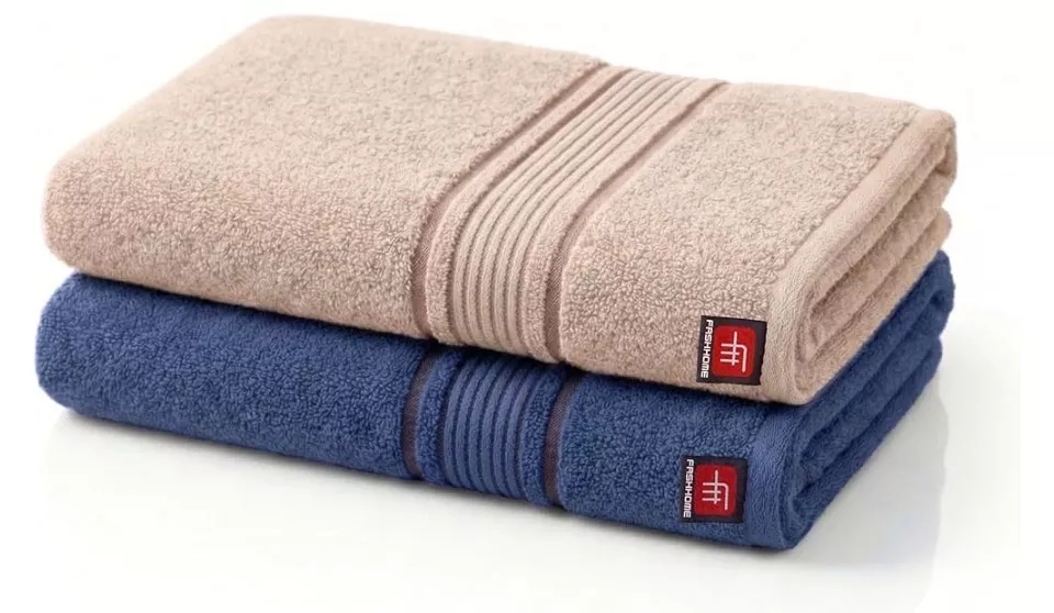 Soft and absorbent towel displayed on a neutral background, showcasing its plush texture and vibrant color, Towel in Yamunana