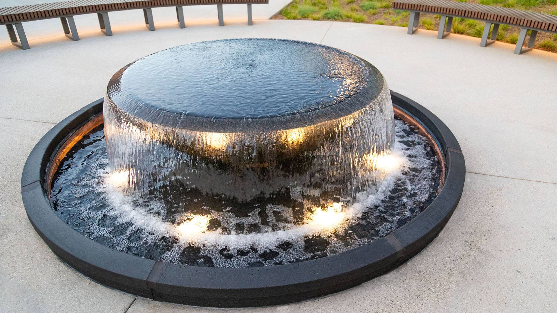 Elegant 7 ft. granite bowl fountain with illuminated water flow, designed for courtyards in Delhi. The fountain features ench