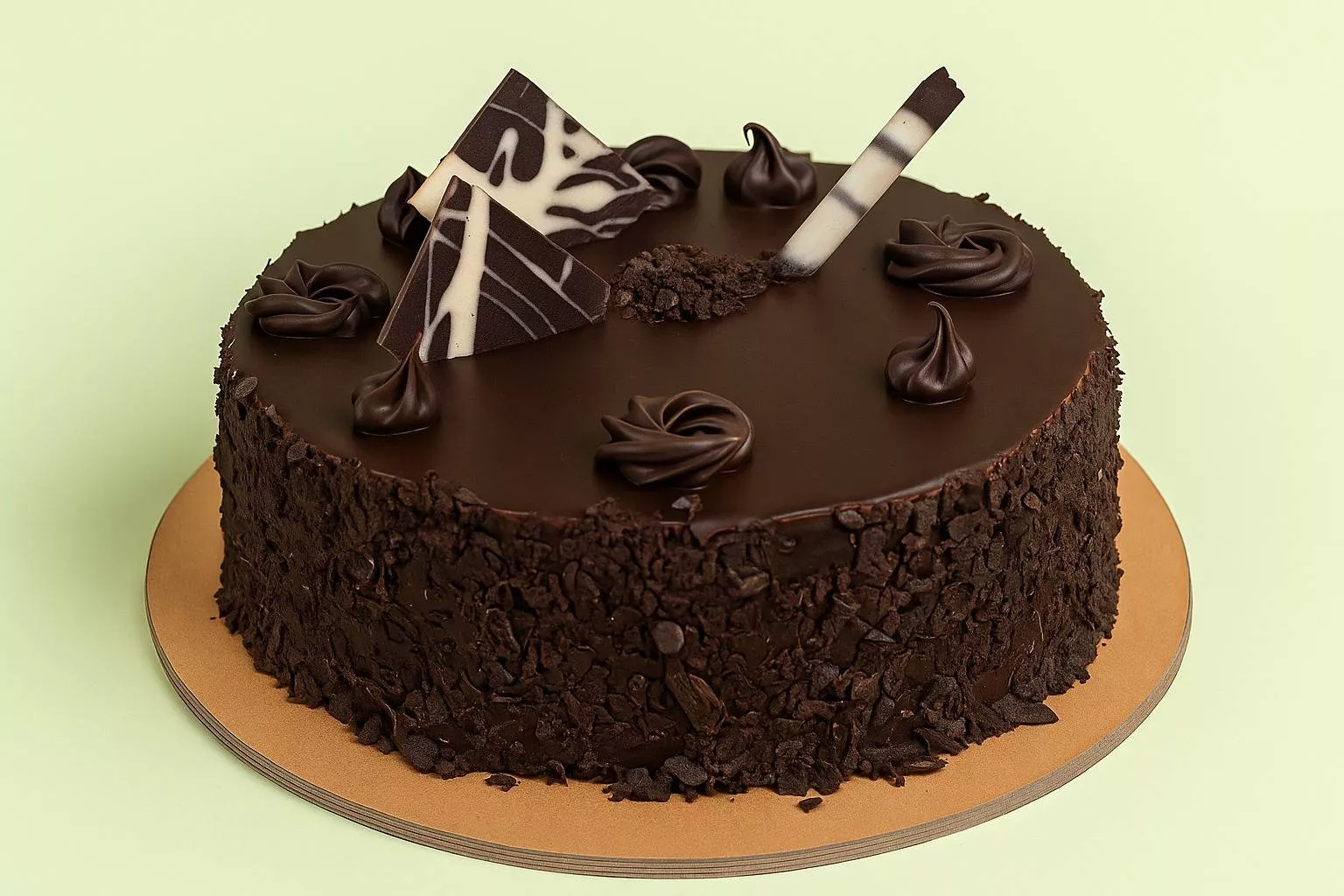 Decadent Chocolate Delite Cake topped with creamy frosting and chocolate shavings, presented beautifully at Cake Palace in Pu
