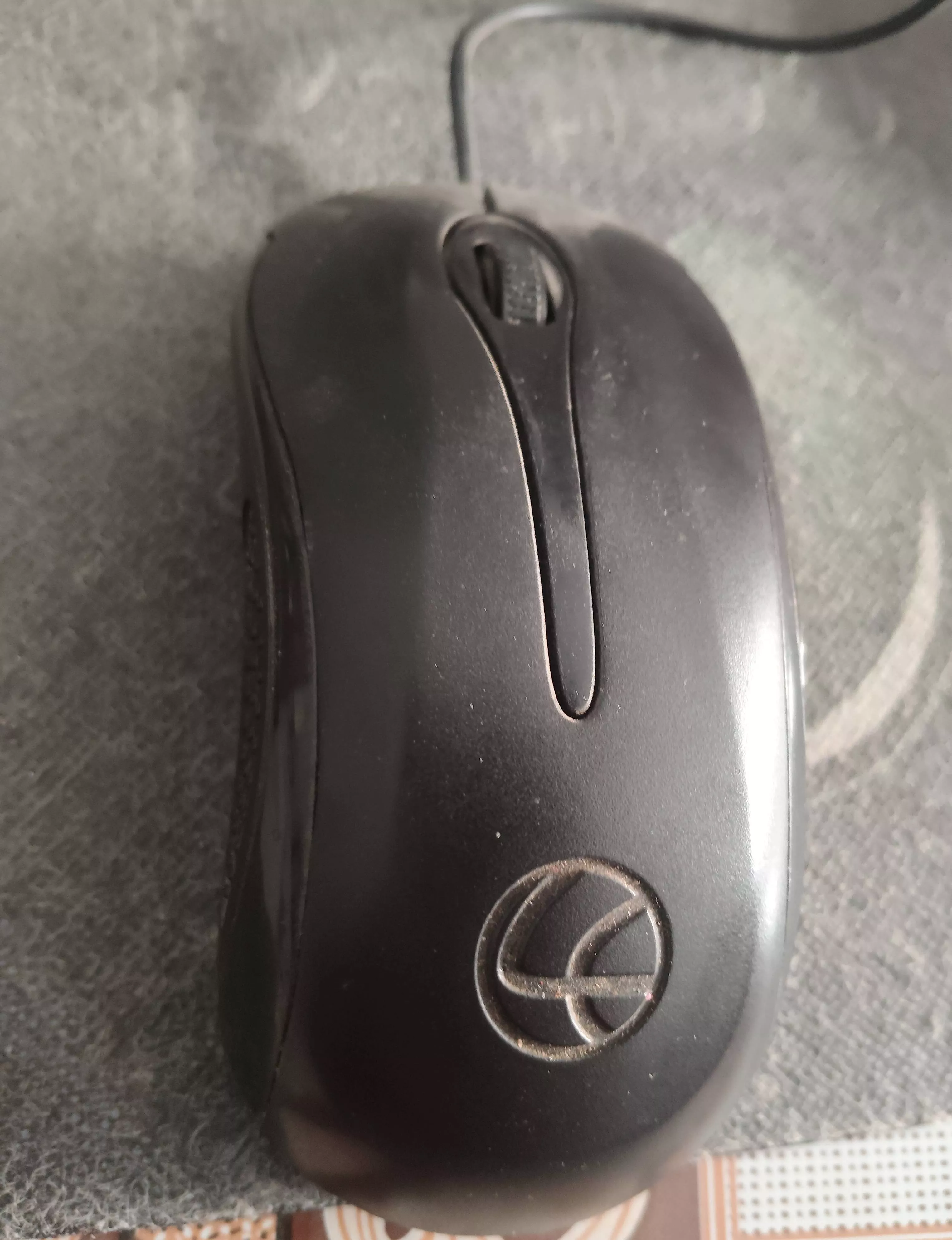 Ergonomic wired optical mouse designed for precise tracking, featuring a sleek black finish and a comfortable grip, available