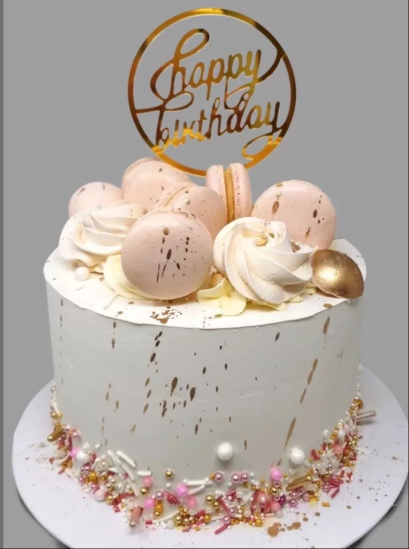 Delicious birthday cake topped with colorful macarons in Jalandhar that adds elegance to celebrations.